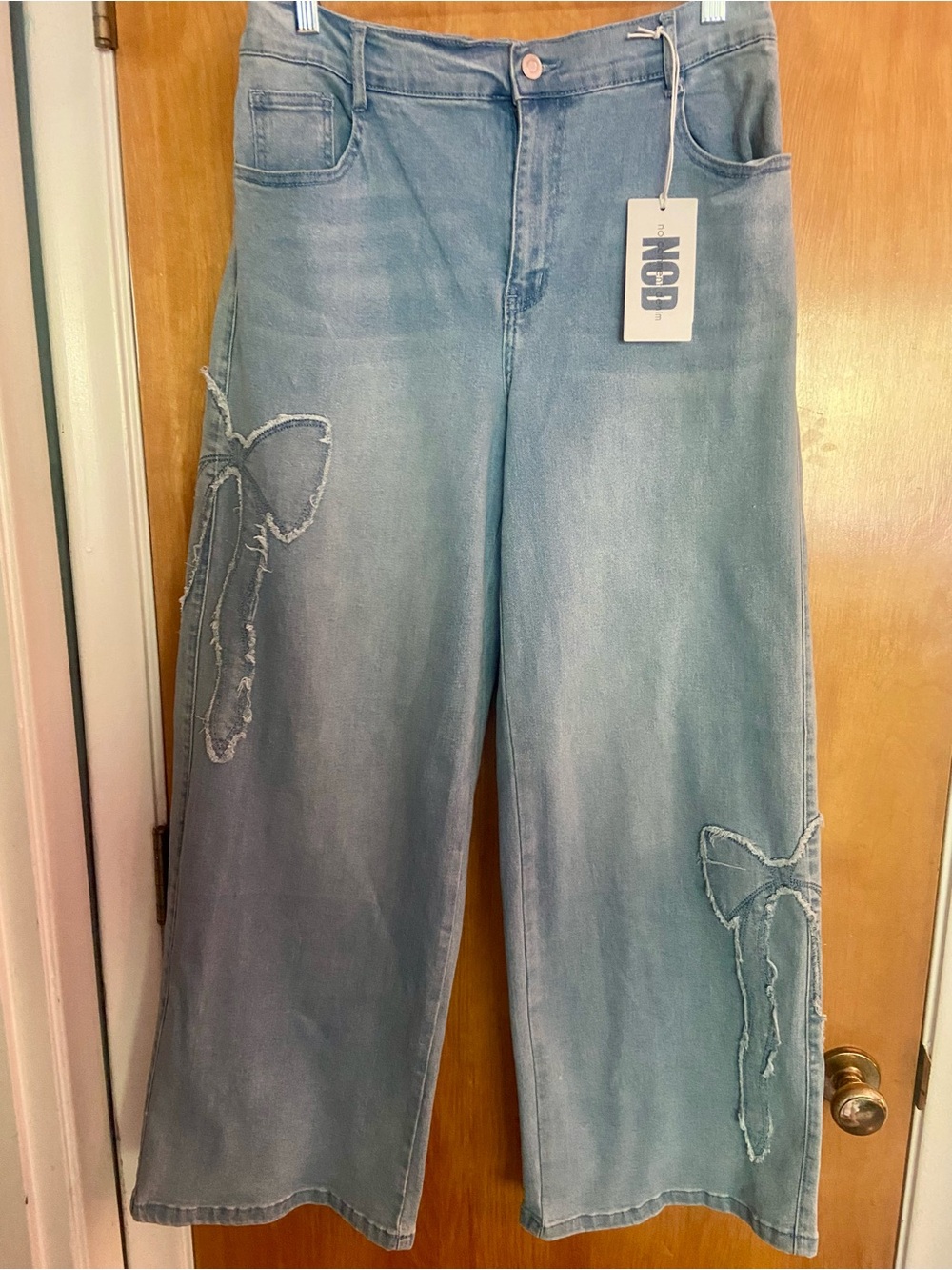 BOWS!! No Comment brand Light Blue Wide-Leg Jeans with Frayed Bow Appliqués